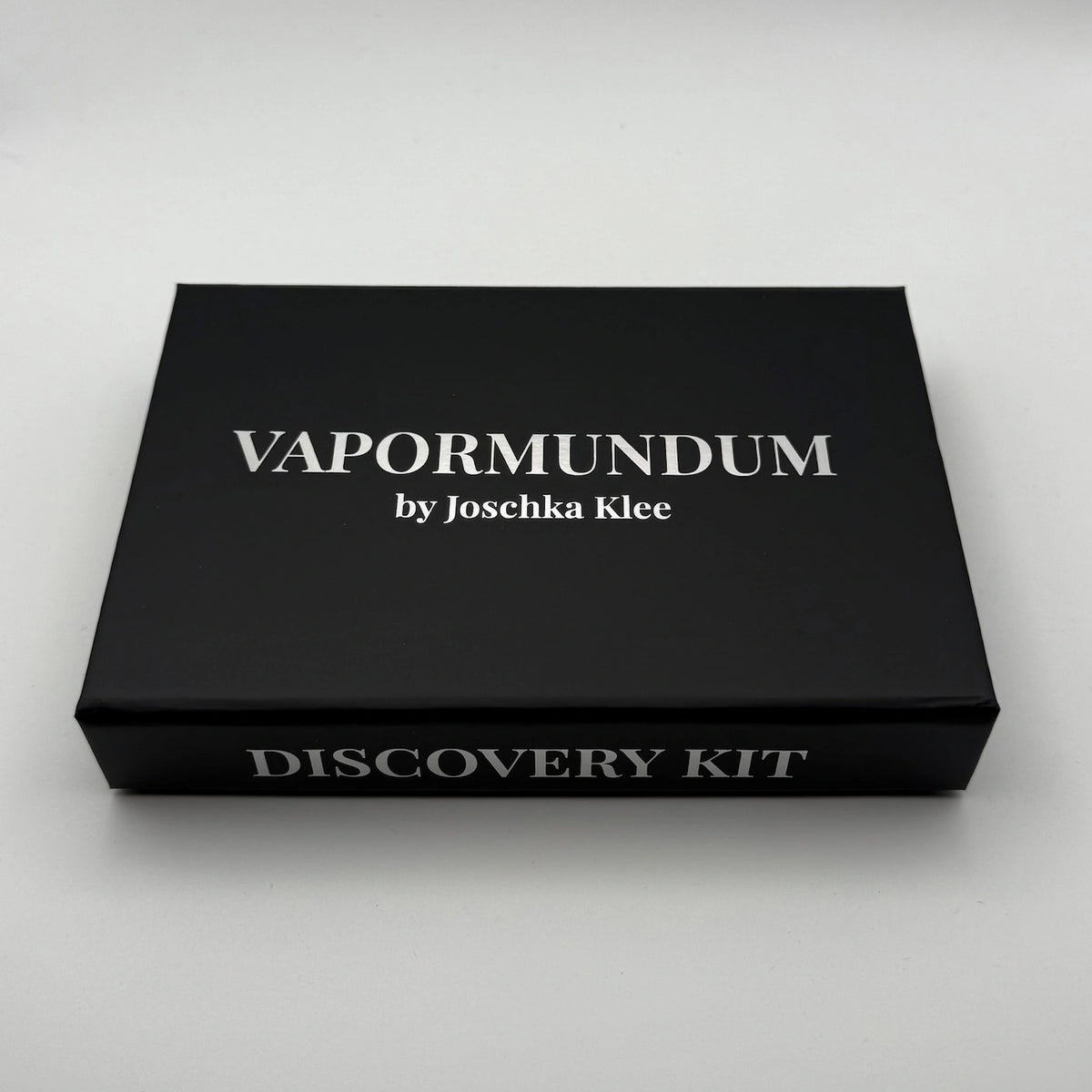 Closed black VAPORMUNDUM by Joschka Klee Discovery Kit presentation box with white serif typography