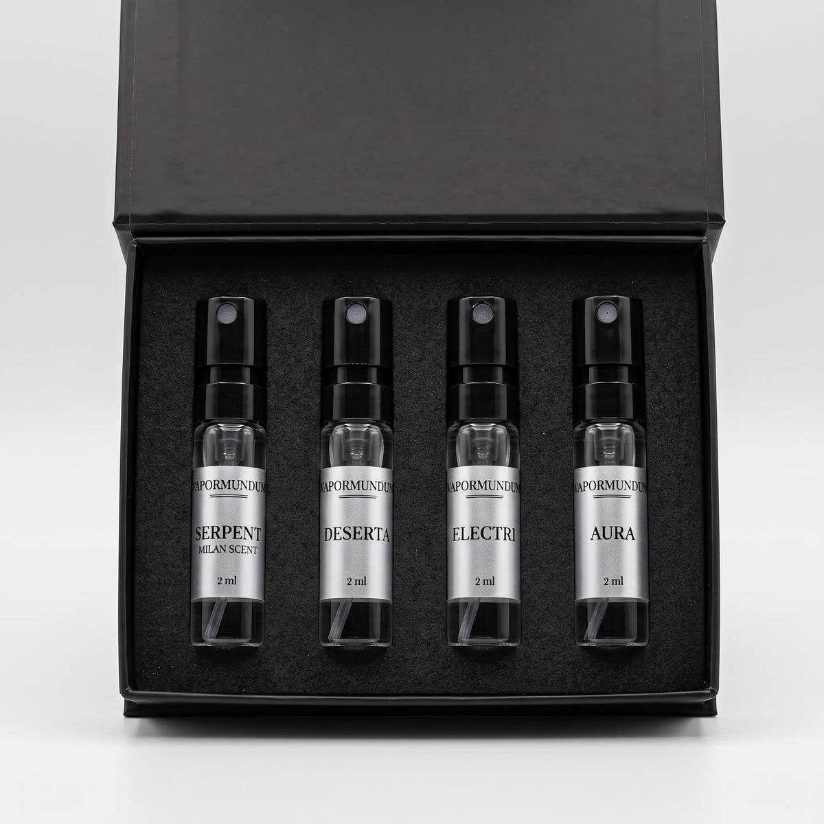 VAPORMUNDUM Discovery Sample Set open presentation box with four 2ml glass perfume spray vials and silver labels