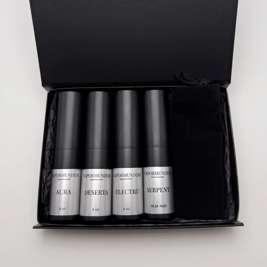 VAPORMUNDUM Discovery Travel Collection open black box with four 8ml matte black perfume atomizers and velvet pouch